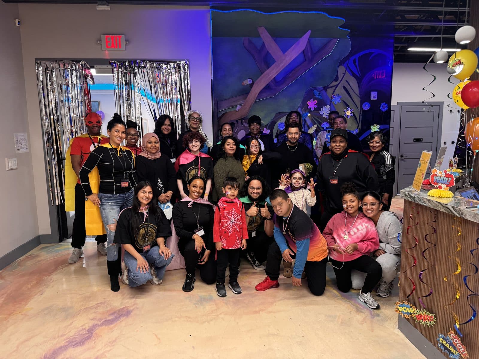 Families, children and staff together at the Spring Super Hero Open House