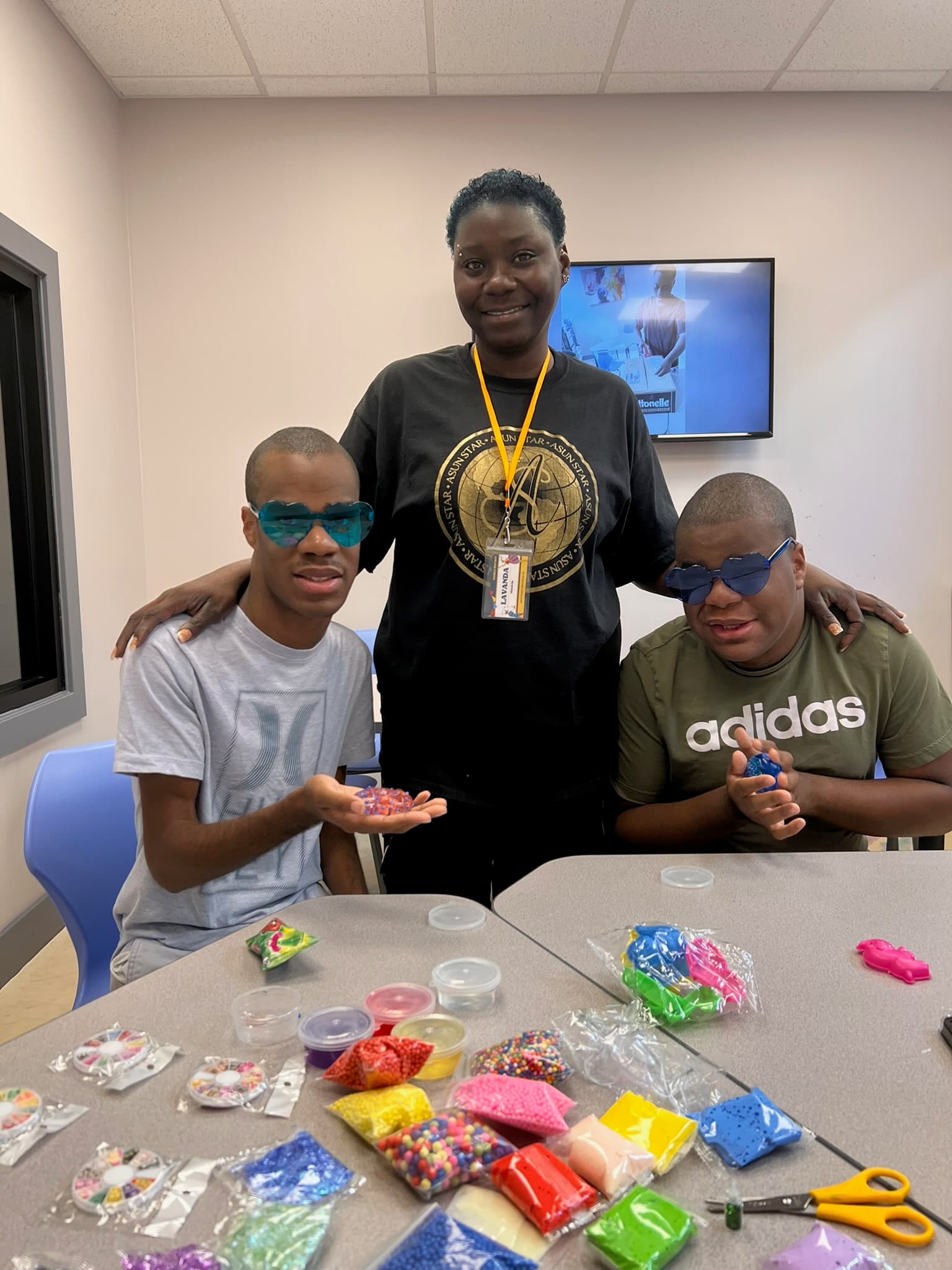 An ASun Star staff member with two adult participants